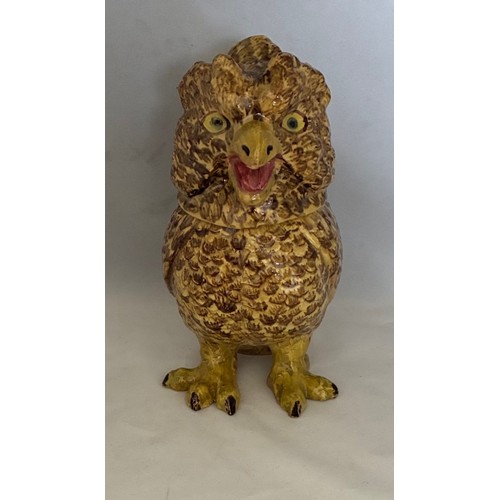 56 - A Martinware style painted pottery jar and cover in the form of a grotesque owl, early 20th century,... 