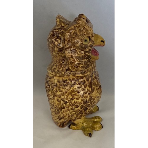56 - A Martinware style painted pottery jar and cover in the form of a grotesque owl, early 20th century,... 
