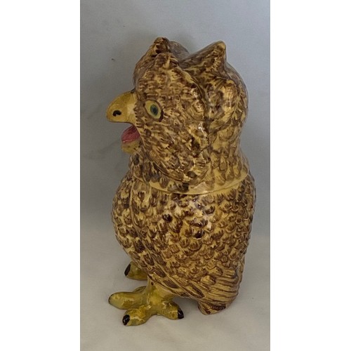 56 - A Martinware style painted pottery jar and cover in the form of a grotesque owl, early 20th century,... 