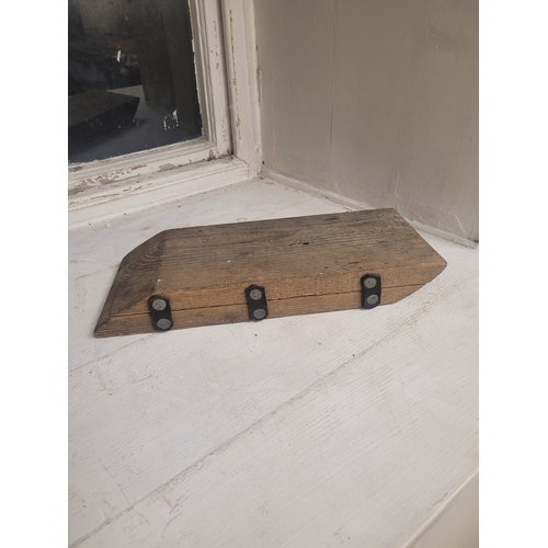 14 - and old wooden door wedge  - used for hanging doors.