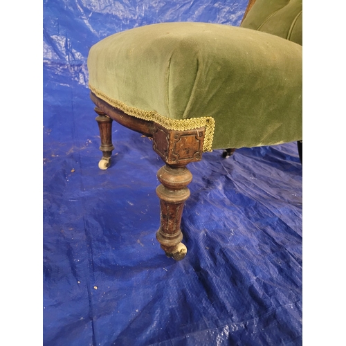 2 - A VICTORIAN BUTTON BACK GREEN VELVET SHOWFRAME SALON CHAIR. WITH ORIGINAL WHITE CERAMIC CASTERS. APP... 