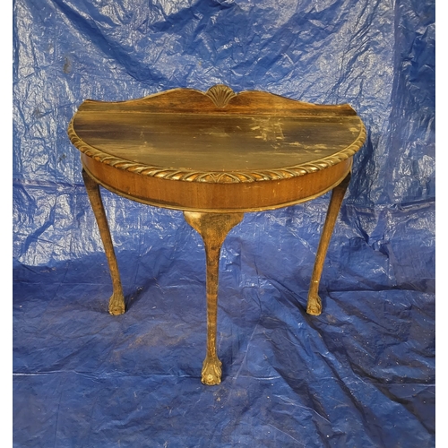 5 - A NEAT ANTIQUE DARK MAHOGANY DEMI LUNE TABLE WITH A DETAILED CARVED ROPE
EDGE AND CLAW AND BALL FEET... 