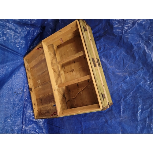 9 - AN ANTIQUE CANVAS COVERED TIMBER TRAVEL TRUNK WITH TIMBER INSERT AND IRON
LATCHES.