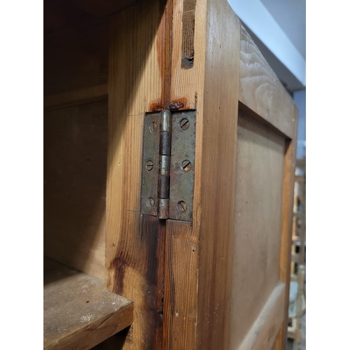 20 - A TALL MID CENTURY PINE DOUBLE DOORED SHELVED LOCKER. IRON HINGES,GOOD
MELLOW COLOUR. EX CHRISTIANS ... 