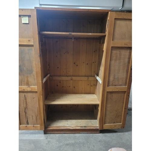 20 - A TALL MID CENTURY PINE DOUBLE DOORED SHELVED LOCKER. IRON HINGES,GOOD
MELLOW COLOUR. EX CHRISTIANS ... 