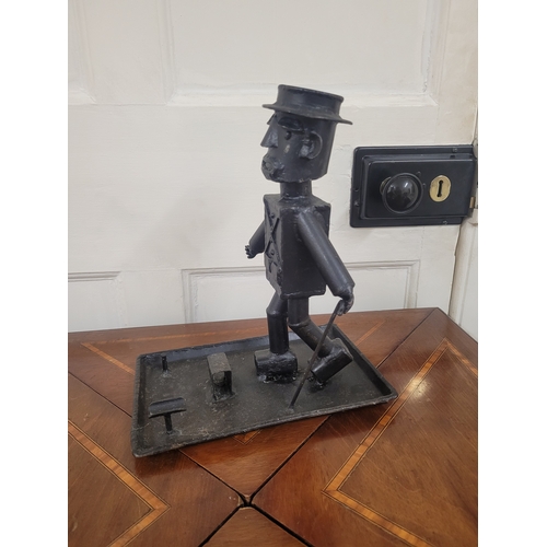 159 - A distinguished gentleman posing as an ashtray complete with matchstick and cigarette holder