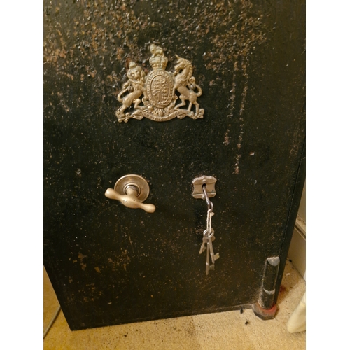 62 - An early 1900s safe with brass royal coat of arms. Possibly military/RIC barracks. In working order ... 