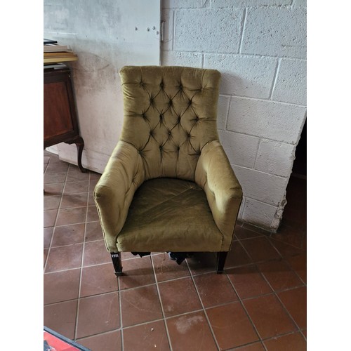 119 - A Victorian button back armchair