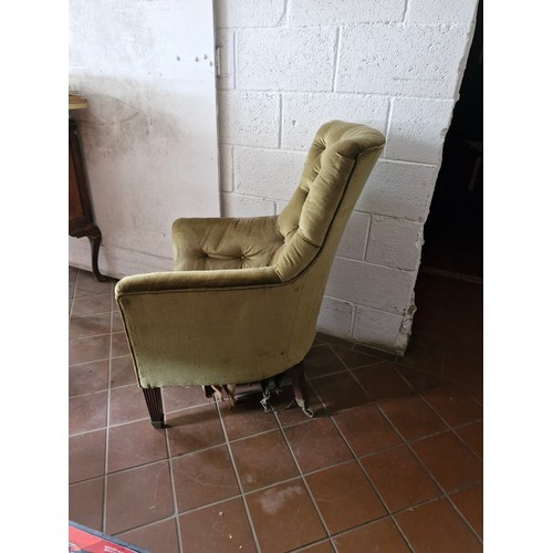 119 - A Victorian button back armchair