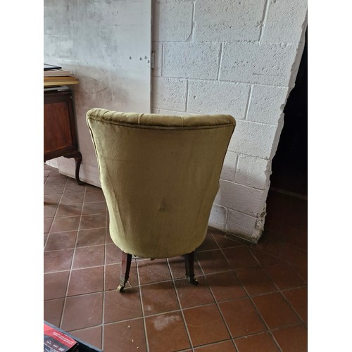 119 - A Victorian button back armchair