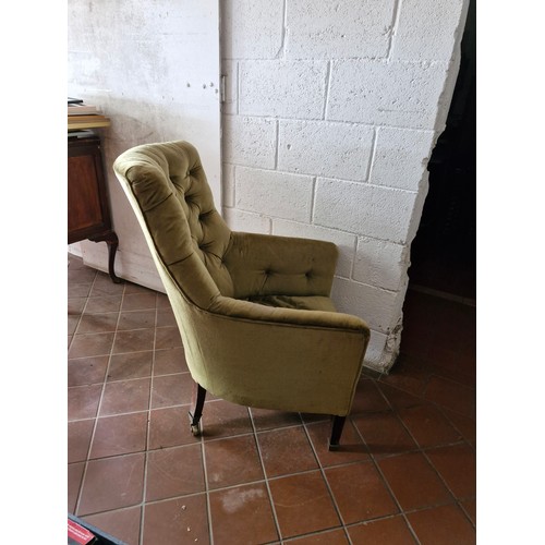 119 - A Victorian button back armchair