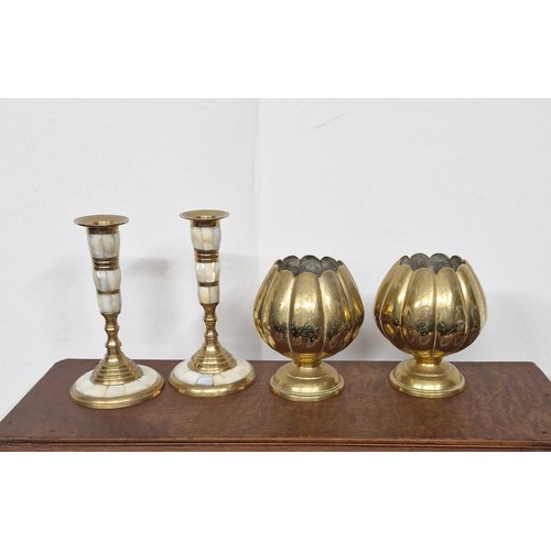 141 - A pair of  brass decorative candlesticks and a pair of brass lotus vases -