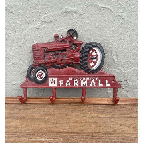 72 - Cast metal coat hanger with tractor design