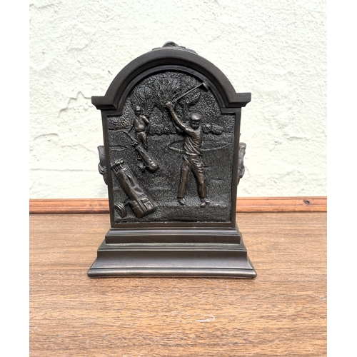 145 - Mantle clock with golf motif -