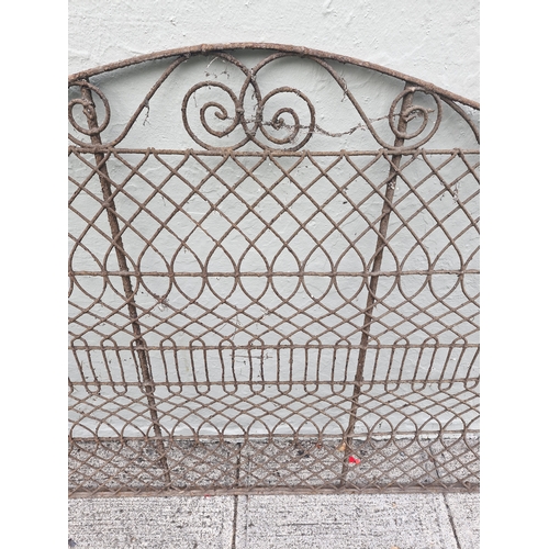 370 - A wrought iron and decorative gate pair. Nice patina...