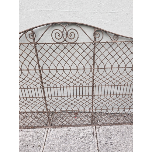 370 - A wrought iron and decorative gate pair. Nice patina...