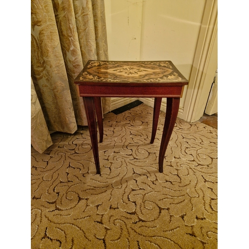 414 - A small side occasional table with marquetry inlay and musical mechanism. Damaged top