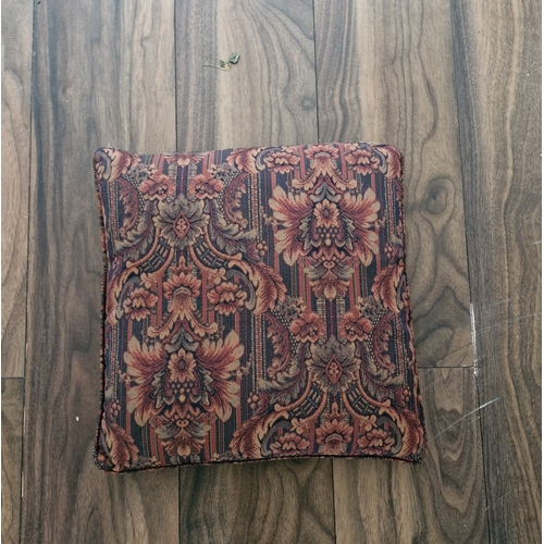 412 - A vintage weighted cushion