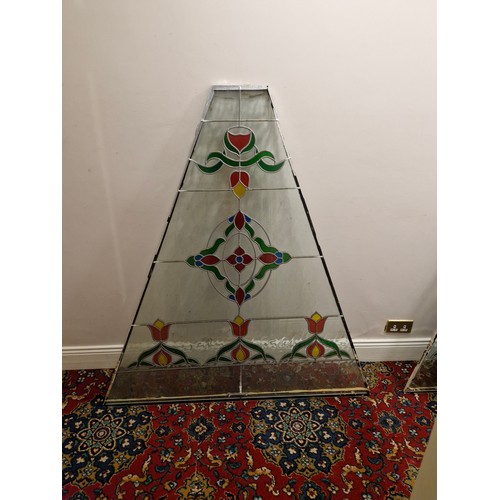 31 - A large triangular stained glass panel.
Dimensions approximate. W 53'' H 57.5'' Top 9'' 2'' thick