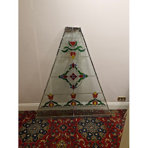 32 - A large triangular stained glass panel.
Dimensions approximate. W 53'' H 57.5'' Top 9'' 2'' thick