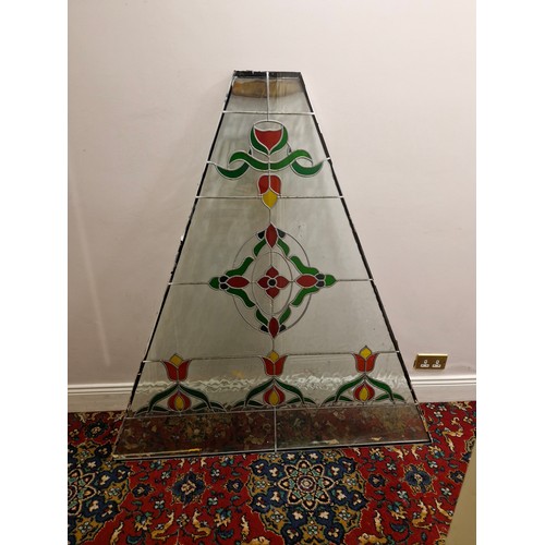 34 - A large triangular stained glass panel.
Dimensions approximate. W 53'' H 57.5'' Top 9'' 2'' thick