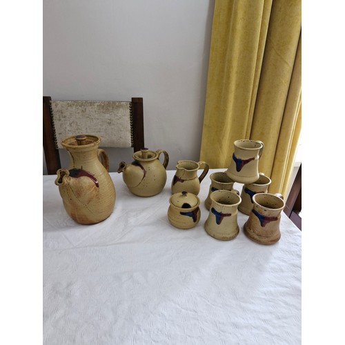 42 - A collection of Badger Hill Irish Pottery; cups plus sugar bowl, milk jug tea pot and coffer pot.