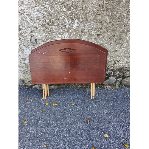 112 - An early 1900s bed frame and two additional headboards.