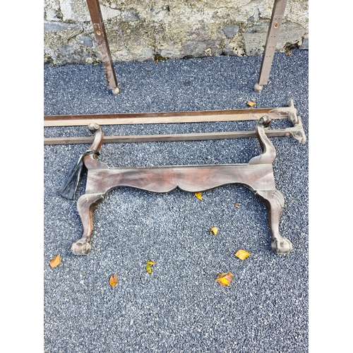 112 - An early 1900s bed frame and two additional headboards.