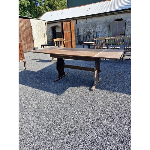 119 - A refectory style dining table expandable with 3 leafs.