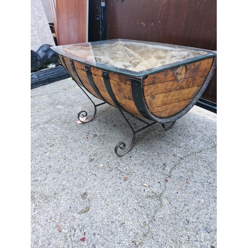 131 - Wine barrell coffee table with glass top and wrought iron legs