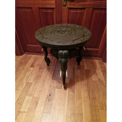 154 - A carved and decorated Anglo Indian occasional table featuring elephant carving. In good order an ea... 