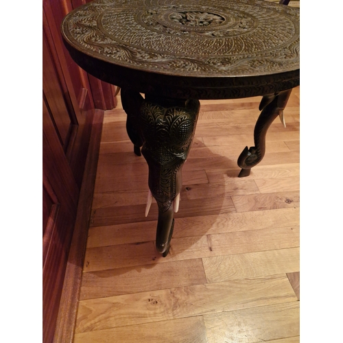 154 - A carved and decorated Anglo Indian occasional table featuring elephant carving. In good order an ea... 