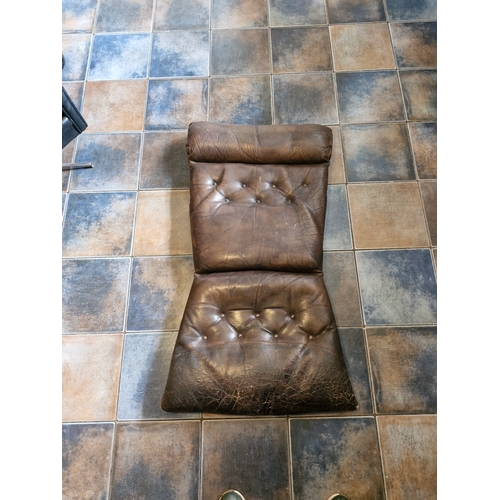 224 - A mid century brown leather cushion