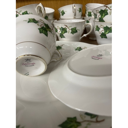 156 - A colclough tea service set and a small teak biscuit or display stand