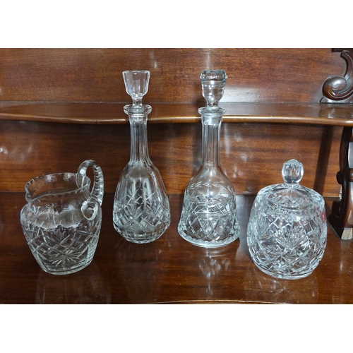 194 - Two crystal decanters, a biscuit barrell and a large jug