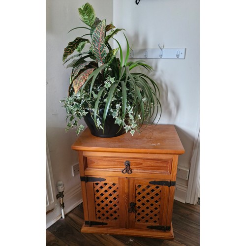 340 - A side cabinet and an indoor plant arrangement (artifical)