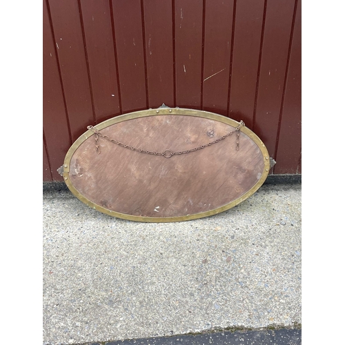 397 - An Edwardian brass rimmed mirror