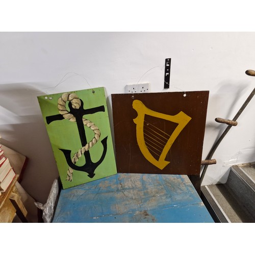 212 - Two handpainted signs one of an anchor and one of a celtic harp.