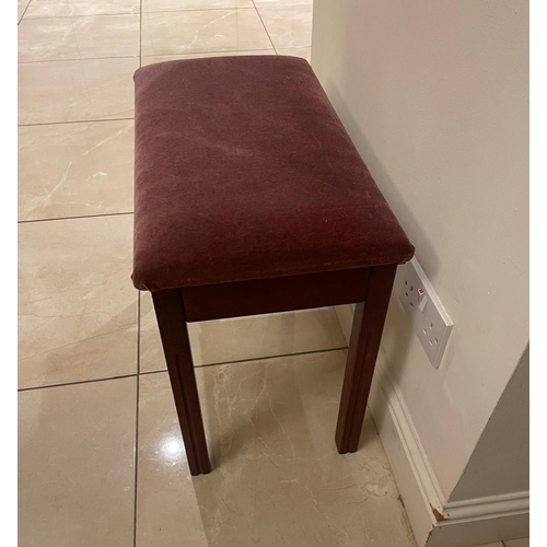 122 - A smart burgundy piano stool