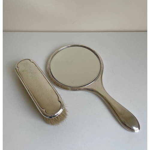 13 - A marked silver hairbrush and mirror