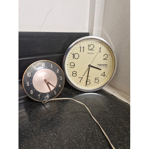 42 - two vintage wall clocks  - Seiko and Metamac