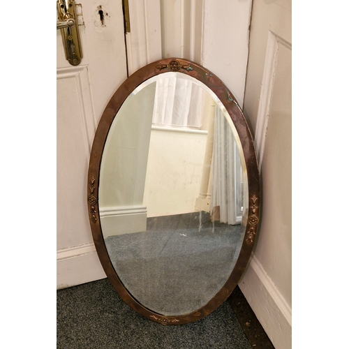 31 - Oval arts and crafts mirror adorned a with Scottish thistle