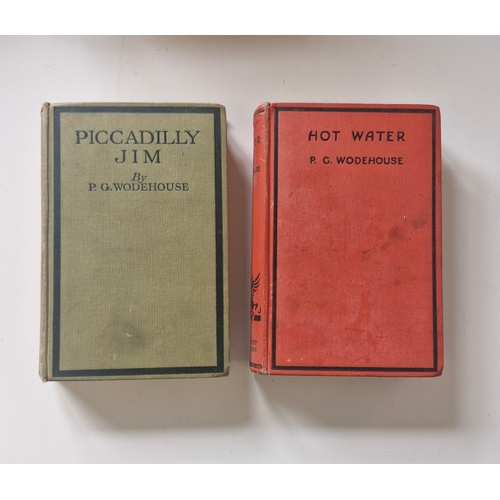 235 - Two early mid 1900s PG Woodhouse hardbacks, Picadilly Jim and Hot Water