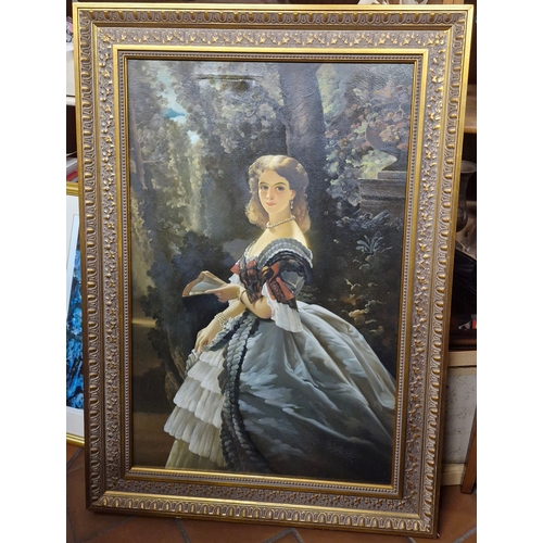 35 - A large oil on canvas of a lady in a garden.
damage to canvas