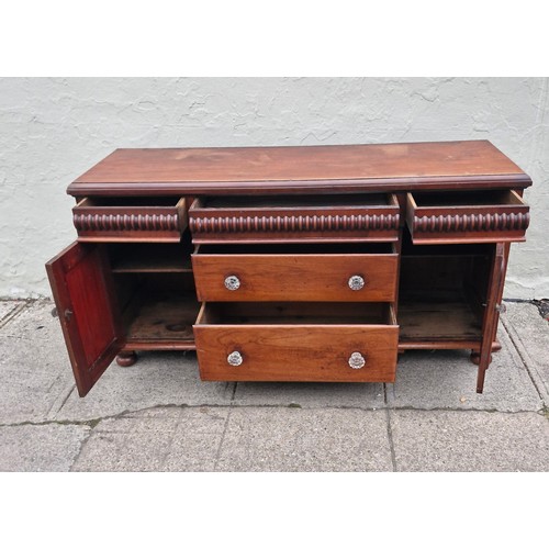 105 - A Victorian mahogany sideboard with original glass nobs