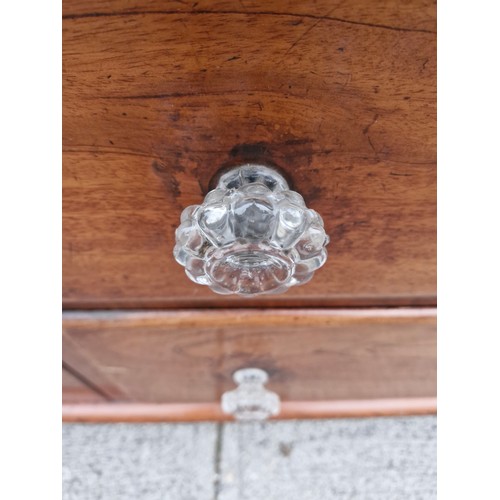 105 - A Victorian mahogany sideboard with original glass nobs