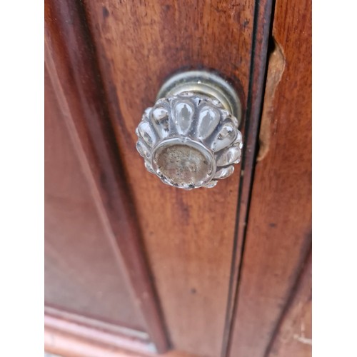 105 - A Victorian mahogany sideboard with original glass nobs