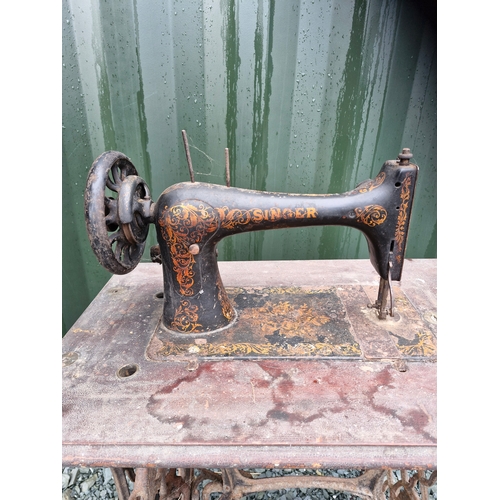 32 - An early 1900s singer sewing table.