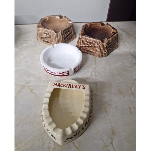 244 - A selection of four Ash trays Carrolls MacKinlays Bushmills.