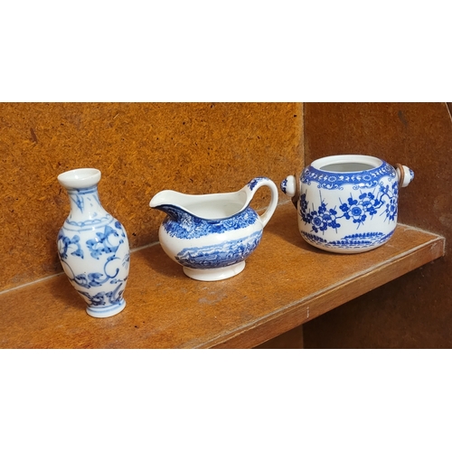 33 - A collection of 3 small Blue and White china items. A jug, a small pot and a miniature vase.